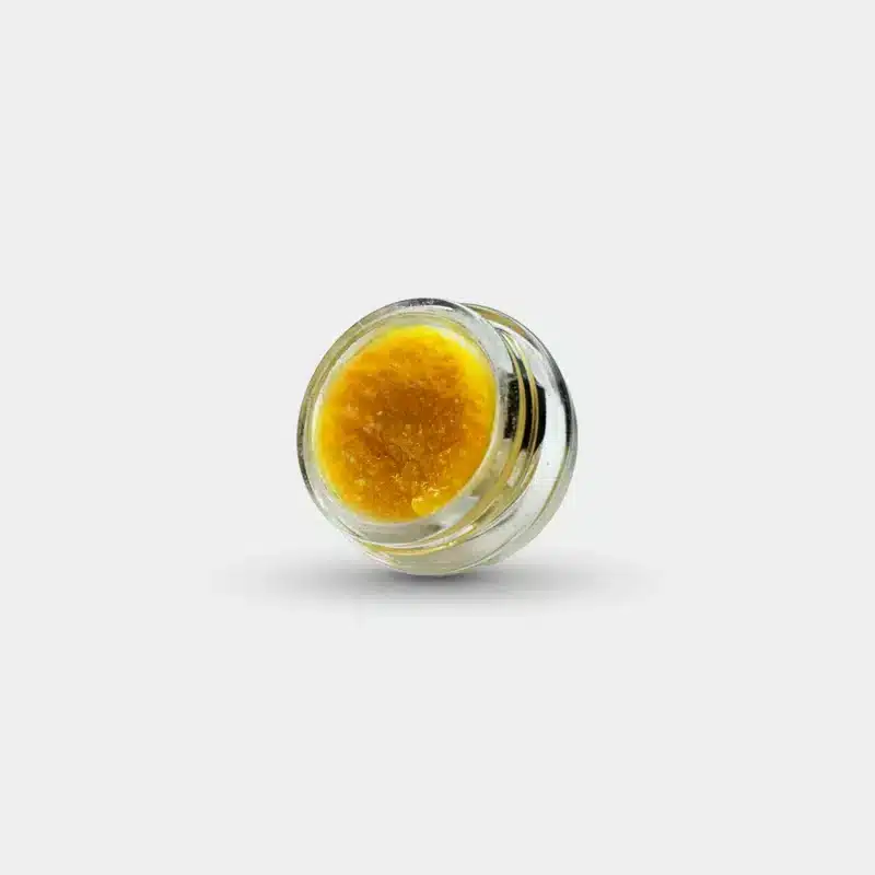 a small container with live rosin concentrate of hemp flower